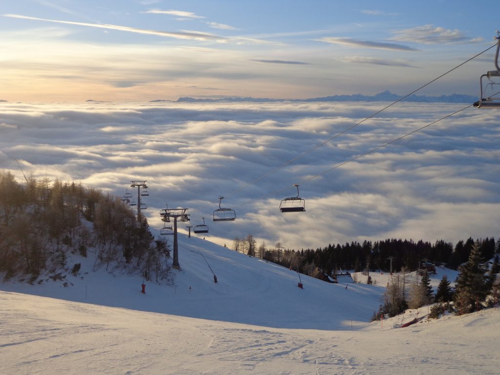 It's not huge, but Krvavec in Slovenia is accessible and cheap