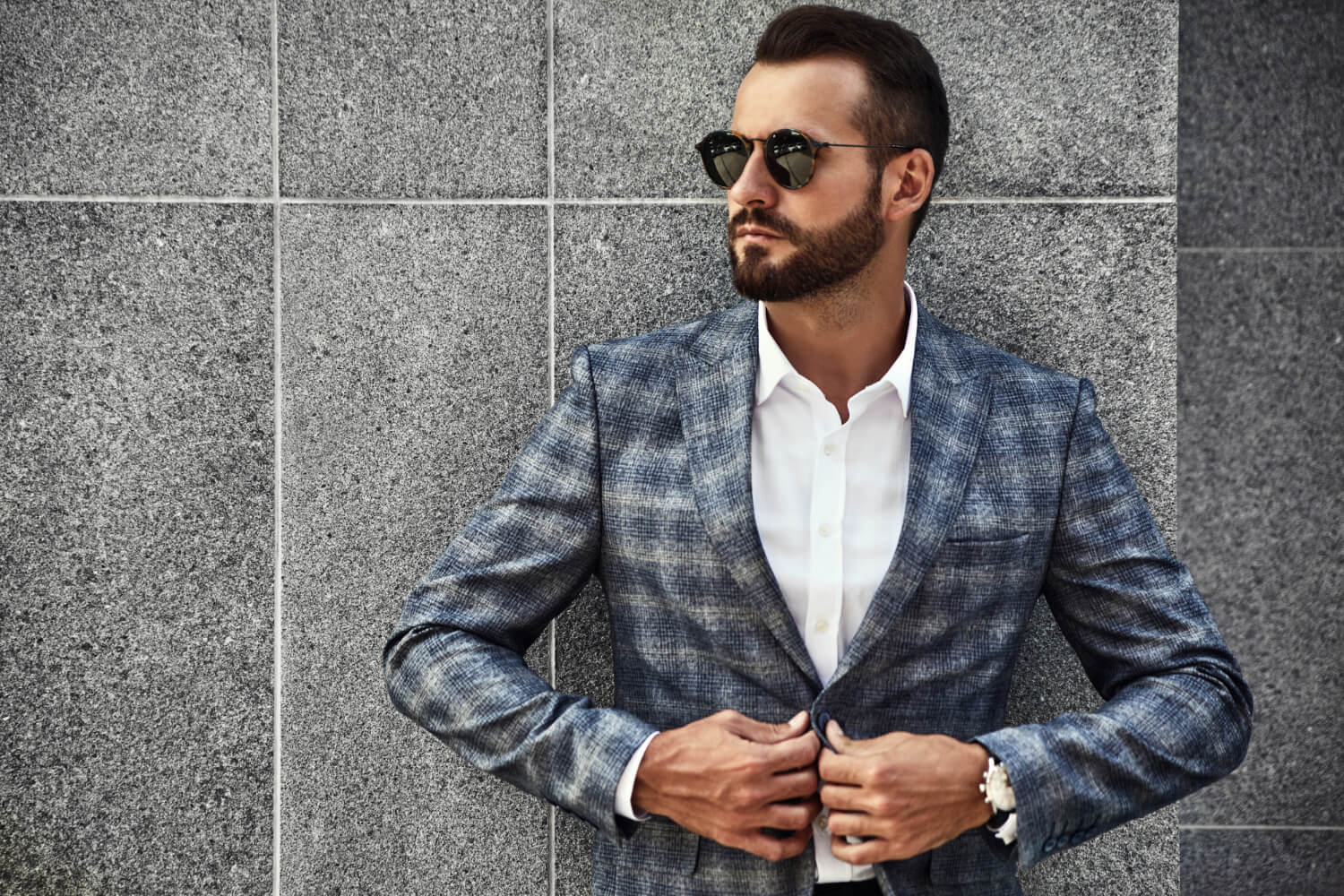 portrait of sexy handsome fashion male model man dressed in elegant suit  posing on the street background Stock Photo | Adobe Stock